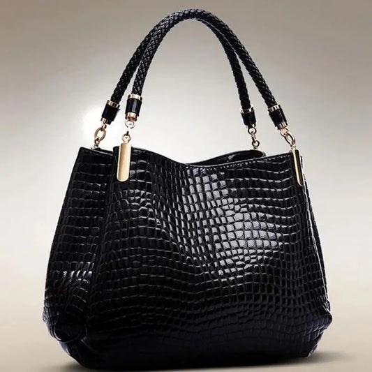 Tijdloze Elegantie voor elke dag deze handtas met krokodillenprint.
